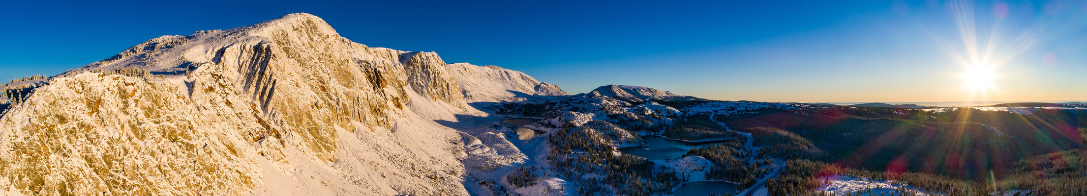 Landscape photo of a sunrise over snowy mountains. 