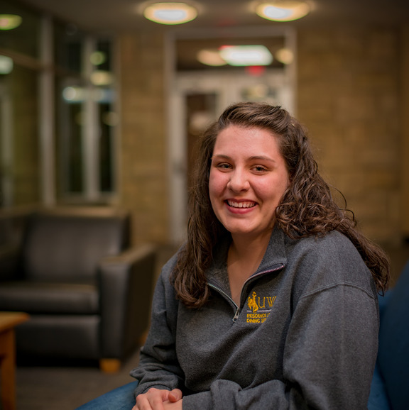 Student smiles at the camera 